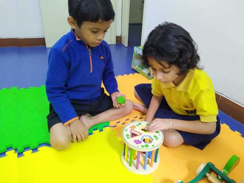 Children engaged in collaborative play-based learning activities at AniBee Preschool classroom in Bangalore
